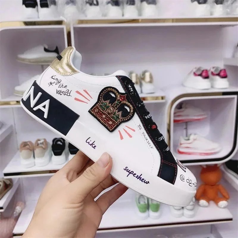 Dolce & Gabbana White Sneakers with Crown Embroidery and Bold Text Design