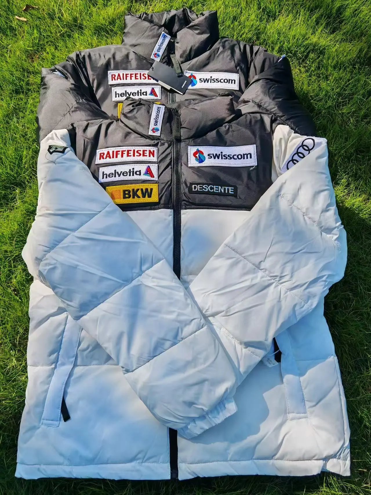 Swiss Alpine Team Down Jacket with Raiffeisen and Swisscom Logos