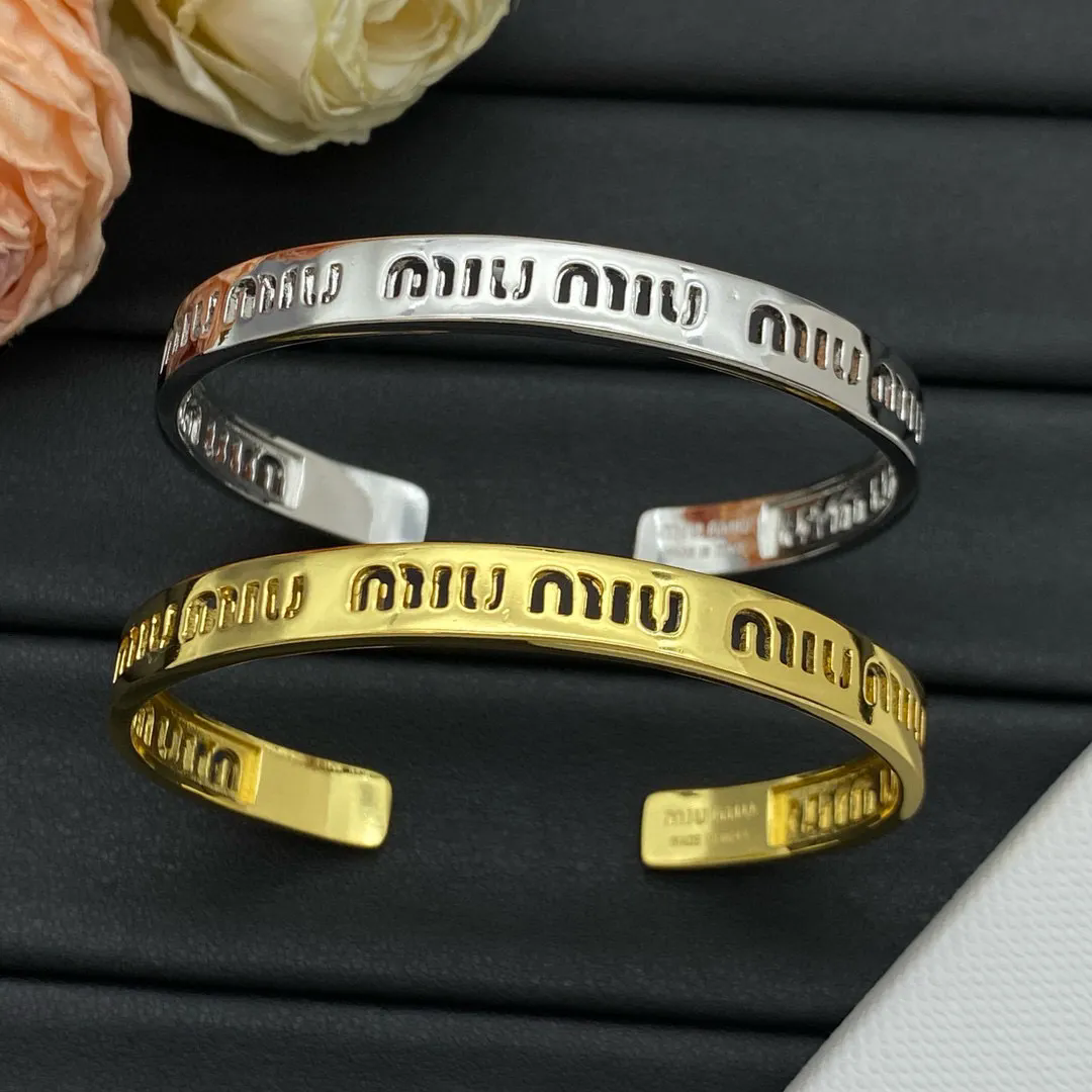 Miu Miu Logo Cuff Bracelet in Gold and Silver